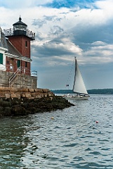 Sailboat Passes Rockland Breakwater Light in Maine